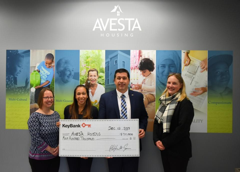 PHOTO: KeyBank Maine Market President Tony DiSotto, second from right, presents a check for $400,000 to (L-R): Avesta Housing Vice President of Property Management & Resident Services Amanda Gilliam, Avesta Housing President & CEO Rebecca Hatfield, and Avesta Housing Vice President of Advancement Sara Olson. (Photo courtesy Avesta Housing)