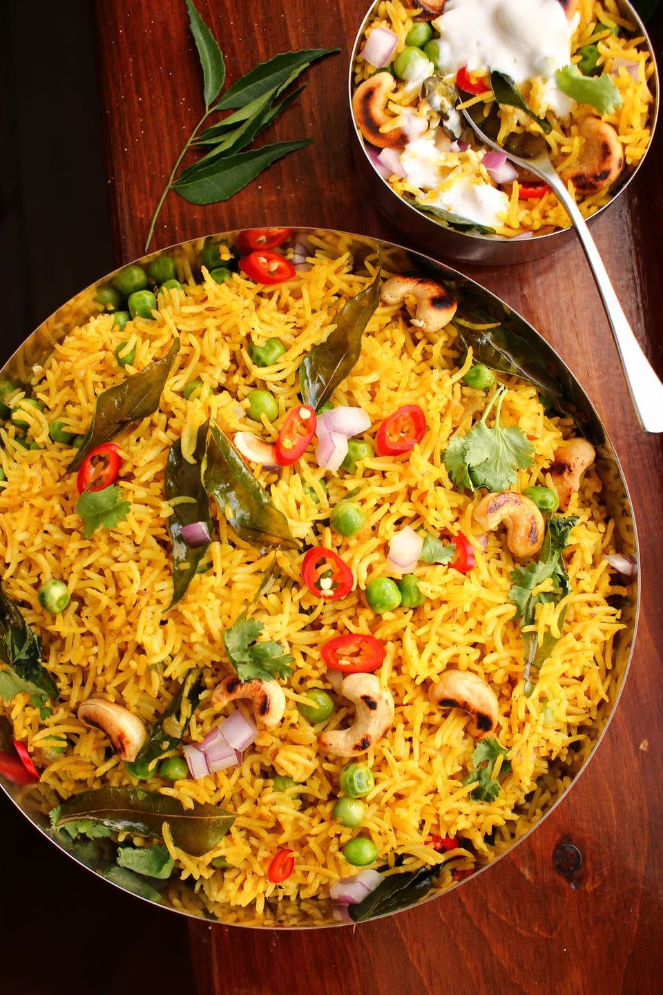 <p>This version of curry rice is a sort of pilaf: rice is toasted in aromatic butter before being steamed to perfection. Perfectly spiced, it makes for a solid side dish, or a filling main.</p><p>Get the <a href="https://www.delish.com/uk/cooking/recipes/a33796271/curry-rice-recipe/" rel="nofollow noopener" target="_blank" data-ylk="slk:Curried Rice;elm:context_link;itc:0;sec:content-canvas" class="link ">Curried Rice</a> recipe.</p>