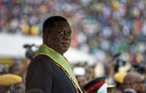 <p>Emmerson Mnangagwa inspects the military parade after being sworn in as President at the presidential inauguration ceremony in the capital Harare, Zimbabwe Friday, Nov. 24, 2017. (Photo: Ben Curtis/AP) </p>