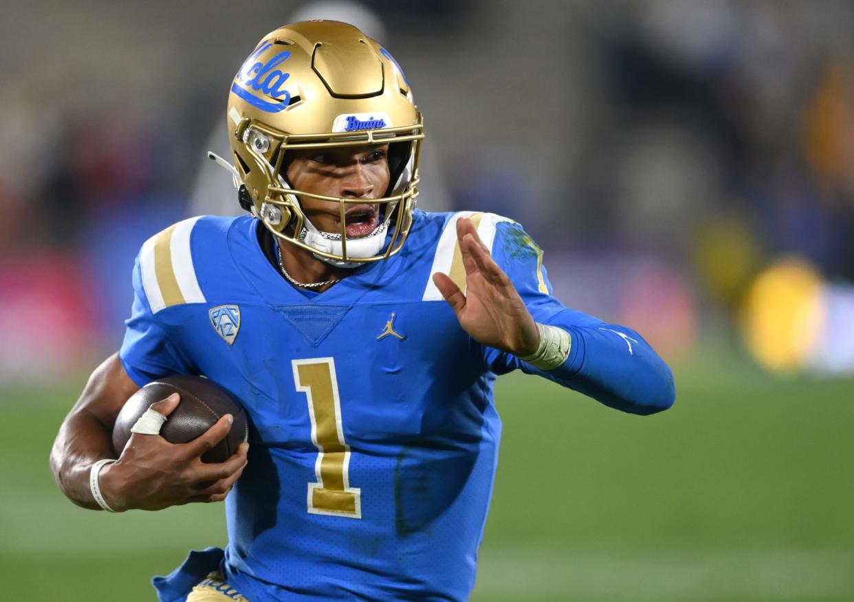 Nov 27, 2021; Pasadena, California, USA;    UCLA Bruins quarterback Dorian Thompson-Robinson (1) runs for 17 yards and a first down against the California Golden Bears in the second half at the Rose Bowl. Mandatory Credit: Jayne Kamin-Oncea-USA TODAY Sports