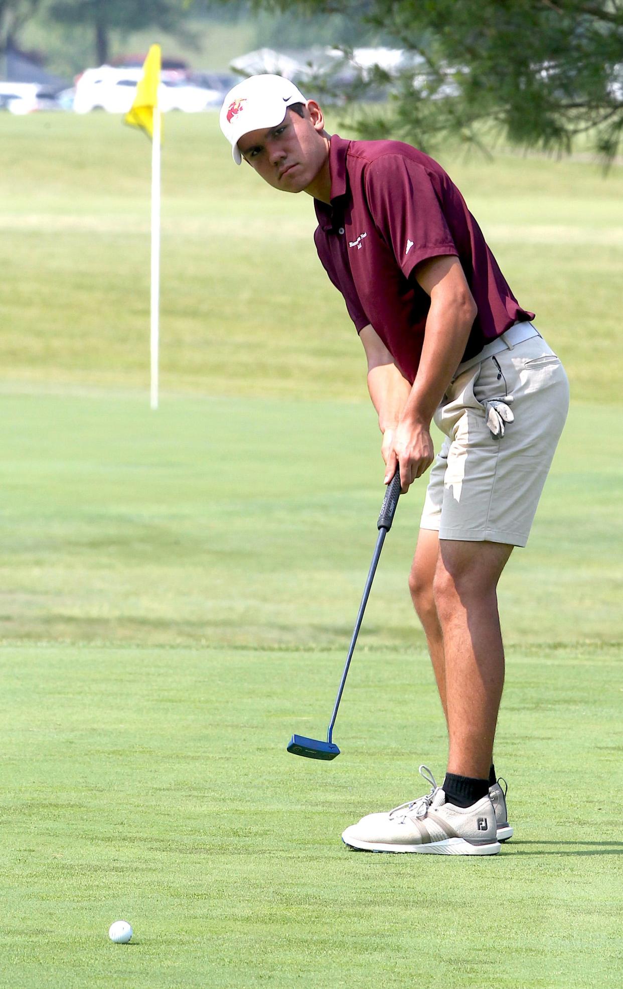 Bloomington North's Hogan Conder putts on the 16th green at Country Oaks Golf Course during the IHSAA regional golf meet on Thursday, June 8, 2023.