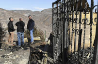 From left, L.A. Mayor Eric Garcetti, L.A. City Councilman Mike Bonin and California Governor Gavin Newsom view a burned and home along Tigertail Road in Brentwood, Calif., Tuesday Oct. 29, 2019. (Wally Skalij/Los Angeles Times via AP, Pool)