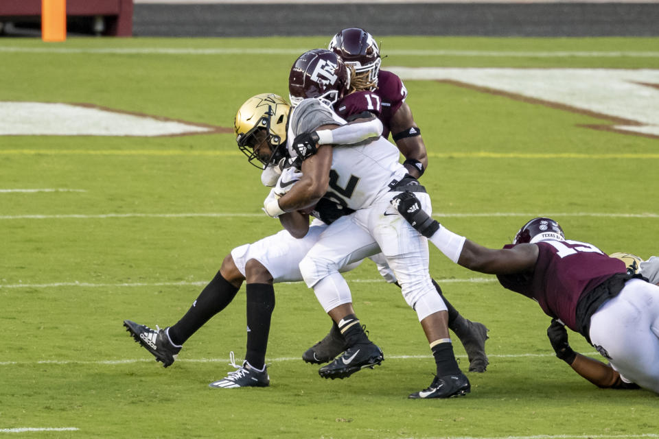 Sep 26, 2020; College Station, Texas; Vanderbilt Commodores running back Jamauri Wakefield (32) is tackled by Texas A&M Aggies defensive back Jaylon Jones (17) during the first half at Kyle Field. Maria Lysaker-USA TODAY Sports