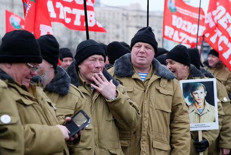 Participants, including veterans of the military campaign, attend a ceremony marking the 30th anniversary of the withdrawal of Soviet troops from Afghanistan at Victory Park, also known as Poklonnaya Gora War Memorial Park, in Moscow, Russia February 15, 2019. REUTERS/Shamil Zhumatov