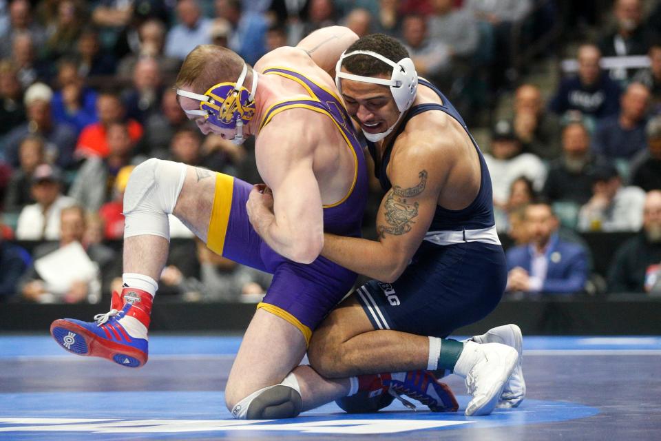 Penn State's Aaron Brooks, right, works against Northern Iowa's Parker Keckeisen during the championship round at the NCAA Division I wrestling championships Saturday, March 18, 2023, in Tulsa, Okla. (Ian Maule/Tulsa World via AP)