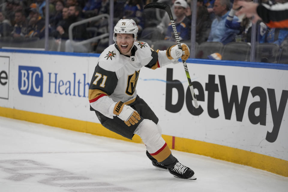 Vegas Golden Knights' William Karlsson celebrates after scoring during the first period of an NHL hockey game against the St. Louis Blues Sunday, March 12, 2023, in St. Louis. (AP Photo/Jeff Roberson)