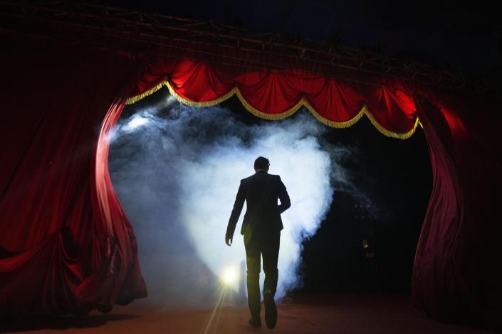 Timoteo Circus conductor and administrative manager Stéfano Rubio takes the stage on the outskirts of Santiago, Chile, Friday, Dec. 9, 2022. The Timoteo Circus is a show that has fought prejudice and discrimination against Chile’s LGBTQ community for more than a half century. (AP Photo/Esteban Felix)