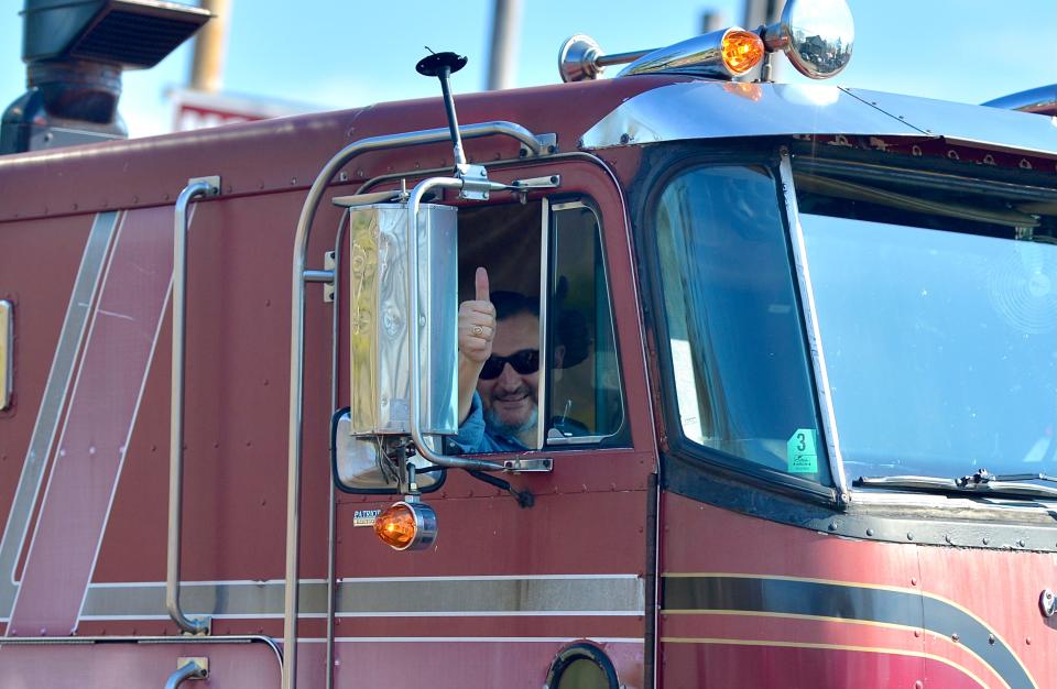 U.S. Sen. Ted Cruz, R-Texas, waves March 10 from the cab of the lead truck departing Hagerstown Speedway in the People's Convoy as it travels again for the Capital Beltway around Washington, D.C.