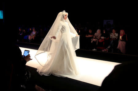 A model presents creations by student designer Lia Rahmawati on the first day of the Indonesia Muslim Fashion Festival in Jakarta, Indonesia, April 19, 2018. REUTERS/Beawiharta