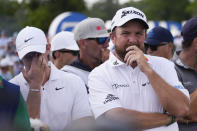 Rory McIlroy, of Northern Ireland, left, and teammate Shane Lowry, of Ireland, wait to tee off the 17th hole during the final round of the PGA Zurich Classic golf tournament at TPC Louisiana in Avondale, La., Sunday, April 28, 2024. (AP Photo/Gerald Herbert)