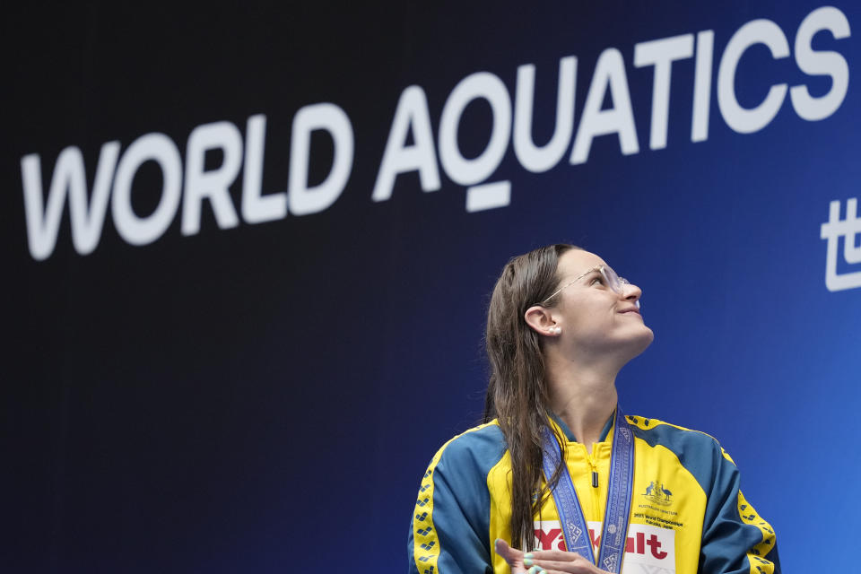 Gold medalist Kaylee McKeown of Australia pose during ceremonies at the women's 100m backstroke finals at the World Swimming Championships in Fukuoka, Japan, Tuesday, July 25, 2023. (AP Photo/Eugene Hoshiko)