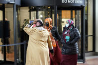 Supporters of former Minneapolis police officer Mohamed Noor leave the Government Center in Minneapolis, Thursday, Oct. 21, 2021. The Minneapolis police officer who fatally shot an unarmed woman after she called 911 to report a possible rape happening behind her home was sentenced to nearly five years in prison — the most the judge could impose but less than half the 12½ years he was sentenced to for his murder conviction that was overturned last month. (AP Photo/Jim Mone)