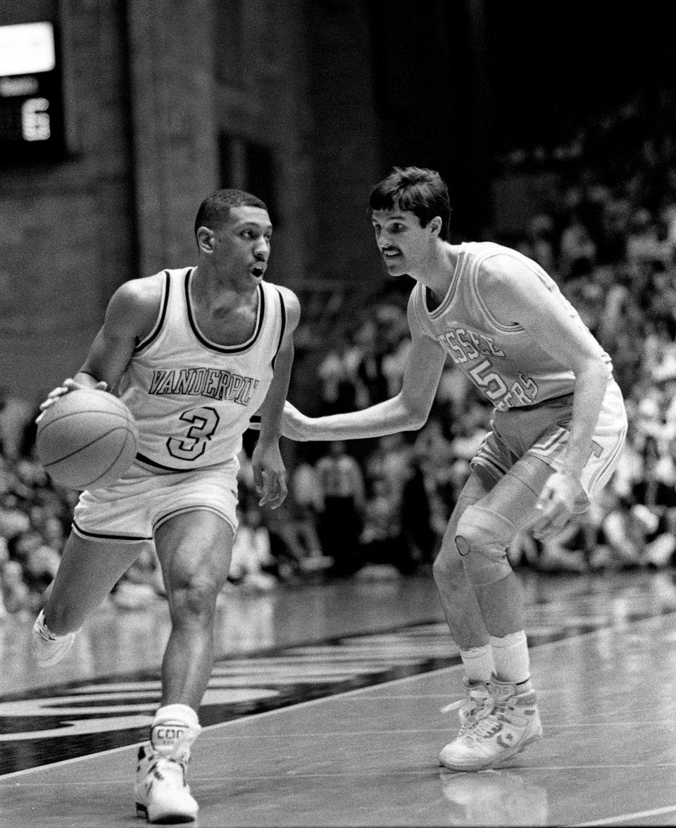 Vanderbilt guard Derrick Wilcox (3) drives past Tennessee’s Travis Henry (25) on his way to the basket during the first half of the Commodores' 68-56 victory over the Vols before 15,646 at Memorial Gym on Feb. 1, 1989.