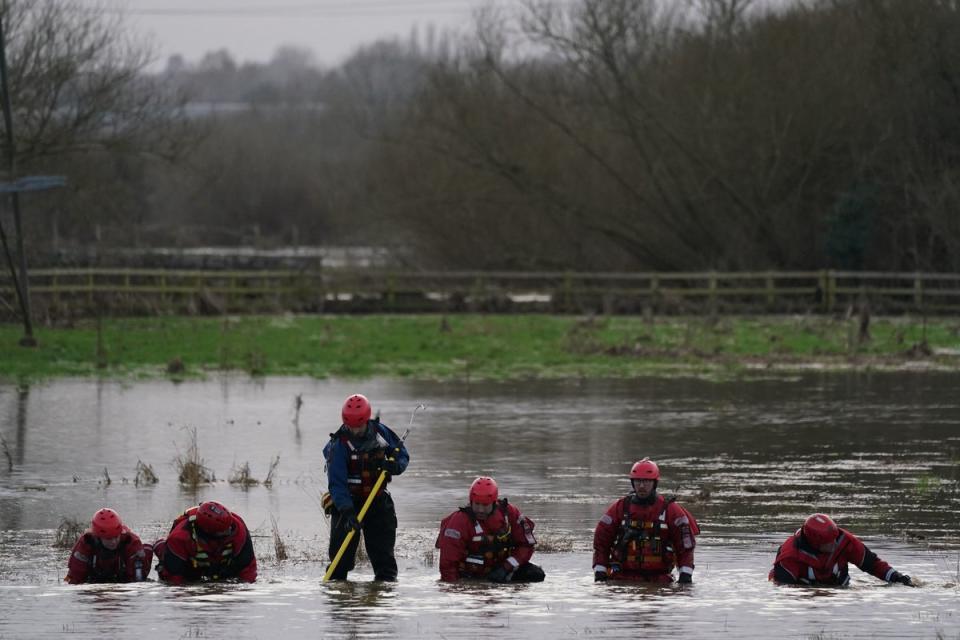 Rescue workers on their hands and knees searching for Xielo (PA)