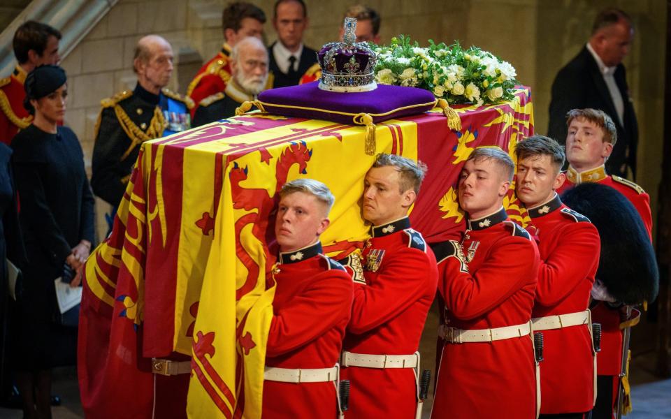 The coffin of Queen Elizabeth II is carried into The Palace of Westminster by guardsmen - Christopher Furlong/Getty Images