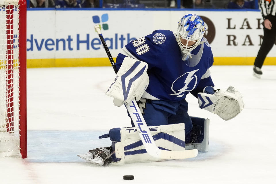 Tampa Bay Lightning goaltender Matt Tomkins (90) makes a pad-save on a shot by the Ottawa Senators during the first period of an NHL hockey game Thursday, April 11, 2024, in Tampa, Fla. (AP Photo/Chris O'Meara)