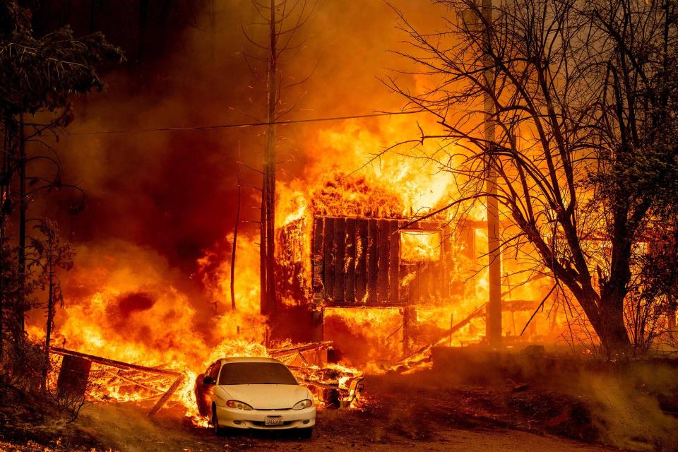 A home is engulfed in flames as the Dixie fire rages on in Greenville, California on August 5, 2021