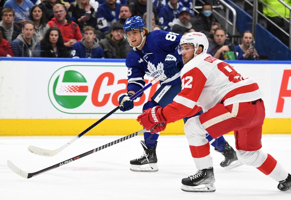 Toronto Maple Leafs forward William Nylander (88) scores past Detroit Red Wings defenseman Jordan Oesterle (82) in the first period at Scotiabank Arena.