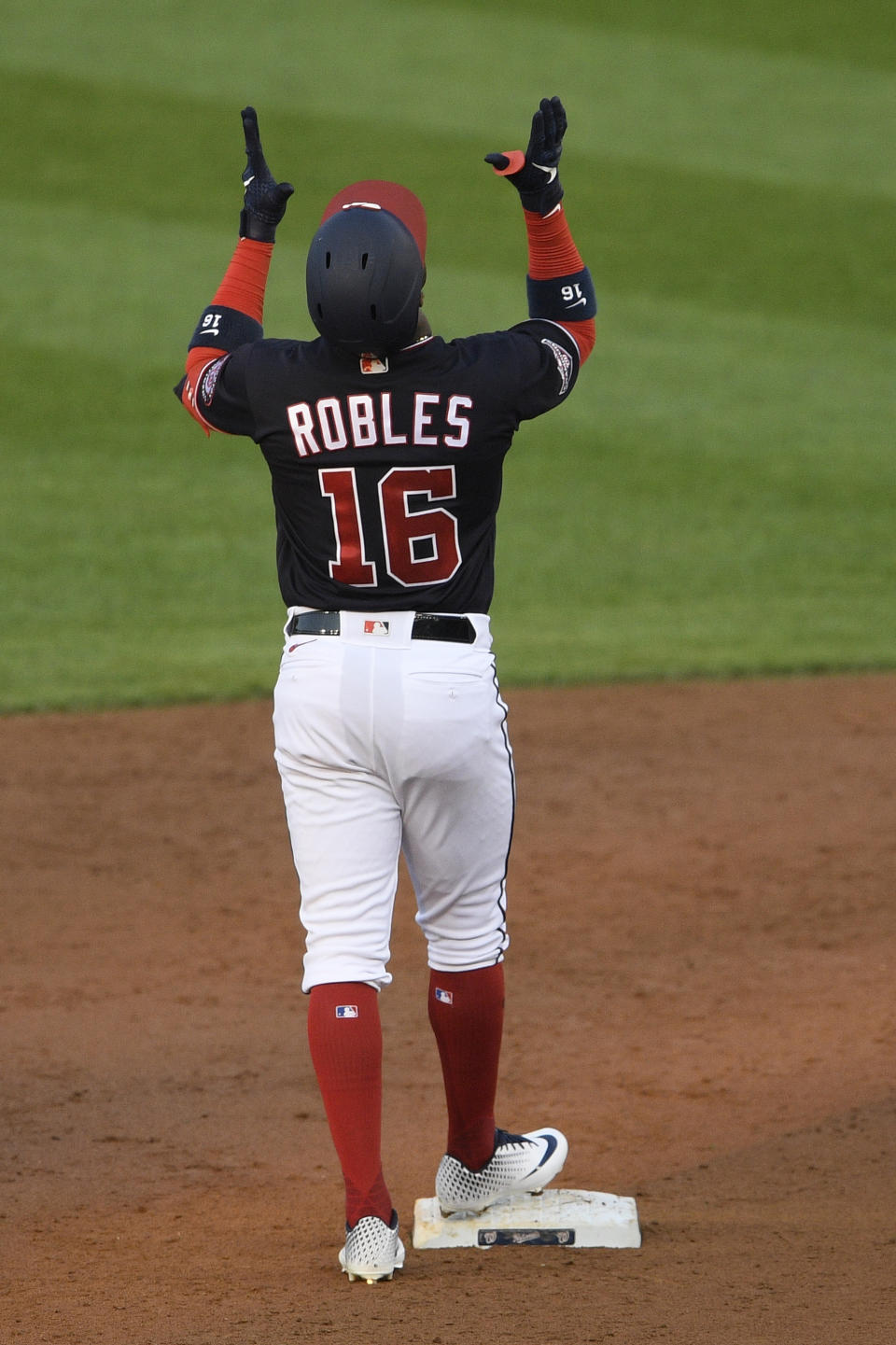 Washington Nationals' Victor Robles reacts after he doubled during the third inning of a baseball game against the Tampa Bay Rays, Monday, Sept. 7, 2020, in Washington. (AP Photo/Nick Wass)