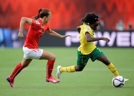 Cameroon forward Gabrielle Onguene (7) controls the ball as Switzerland midfielder Lia Waelti (9) defends during the second half in a Group C soccer match in the 2015 FIFA women's World Cup at Commonwealth Stadium. Mandatory Credit: Erich Schlegel-USA TODAY Sports