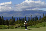 K.H. Lee, of South Korea, lines up his putt after missing birdie on the ninth green during the second round of the Tournament of Champions golf event, Friday, Jan. 7, 2022, at Kapalua Plantation Course in Kapalua, Hawaii. (AP Photo/Matt York)