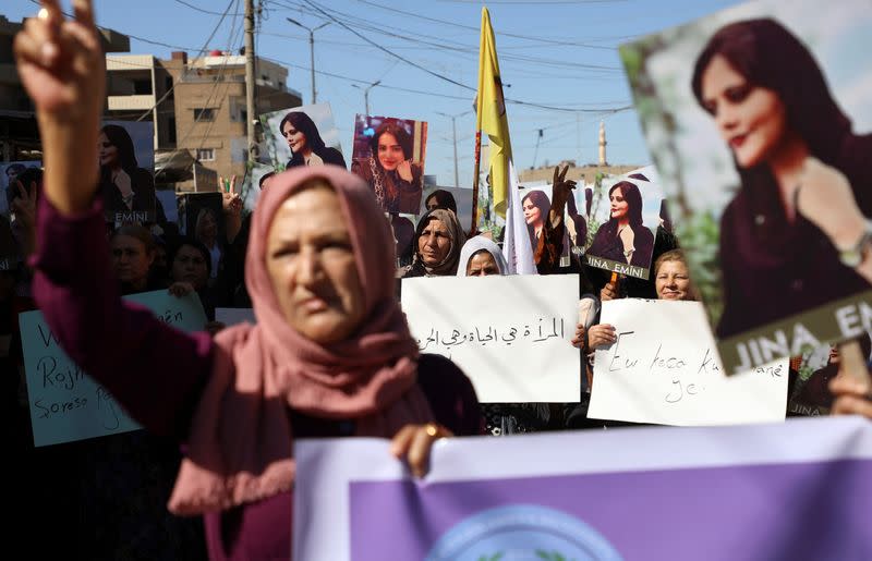 Women protest over the death of Mahsa Amini in Iran, in the Kurdish-controlled city of Qamishli