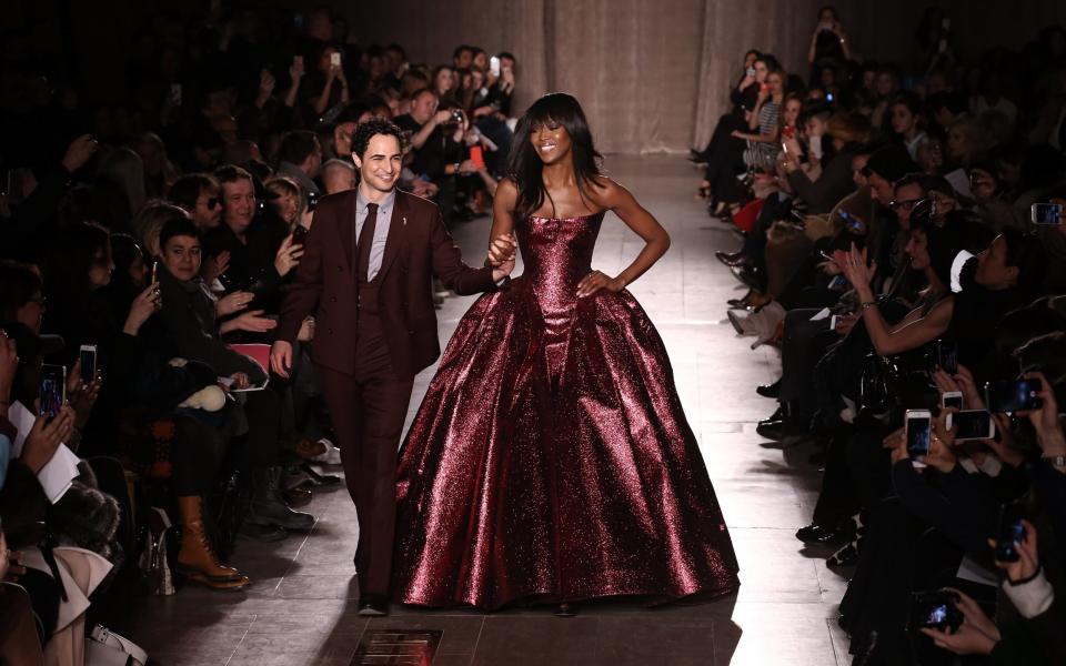 Walking the runway at New York Fashion Week with Naomi Campbell during his own show in 2015