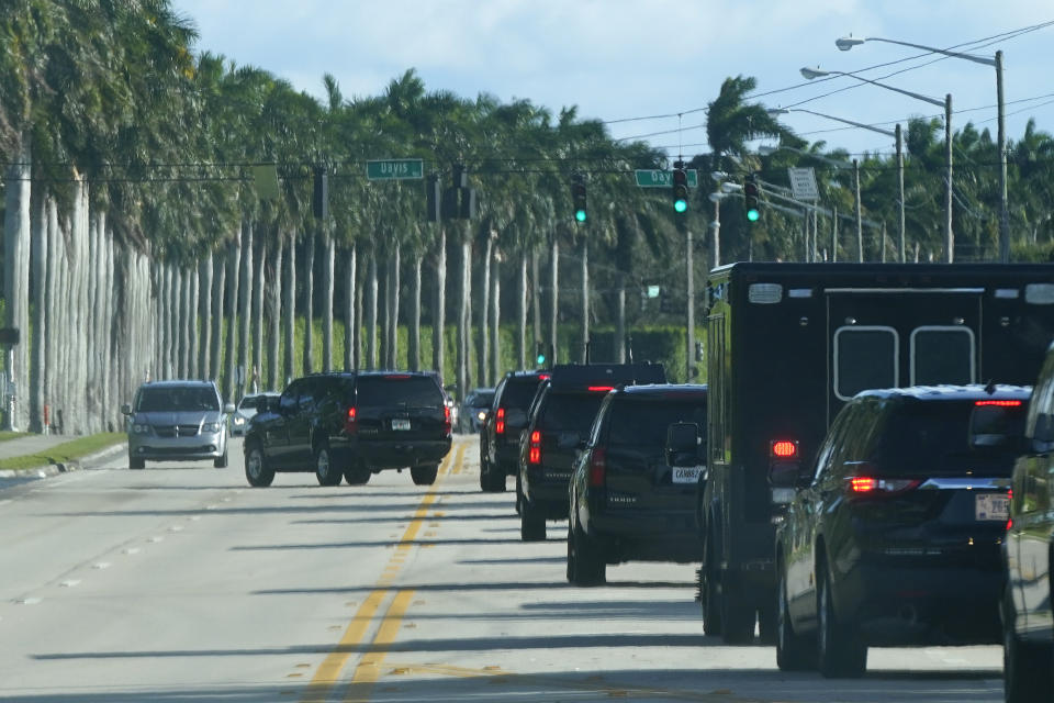 President Donald Trump's motorcade drives to the Trump International Golf Club, Friday, Dec. 25, 2020, in West Palm Beach, Fla. (AP Photo/Patrick Semansky)