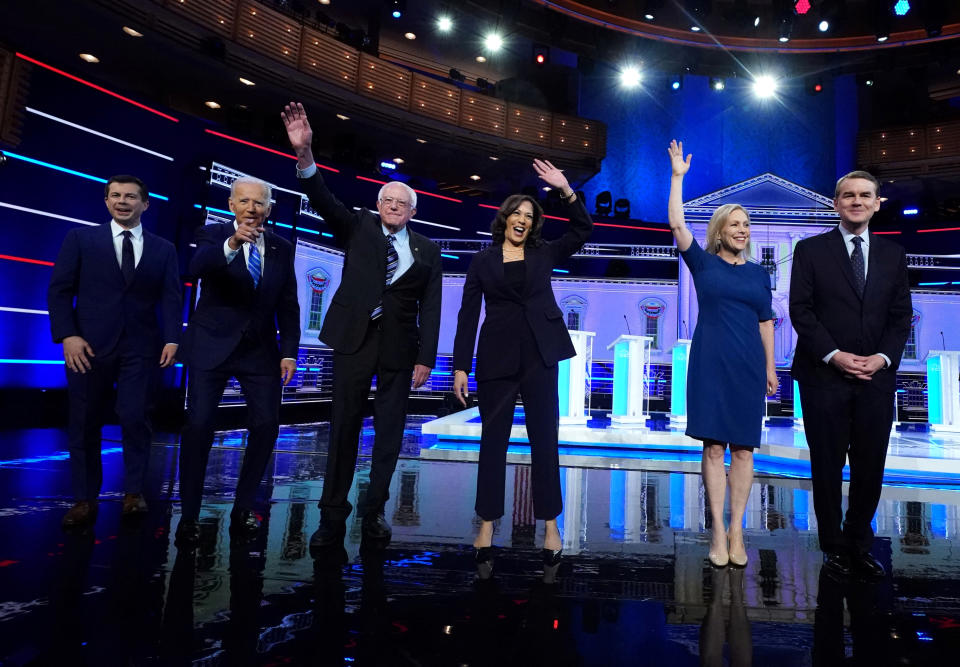 Democratic U.S. 2020 election presidential candidates including South Bend Mayor Pete Buttigieg, former Vice President Joe Biden, Senator Bernie Sanders, Senator Kamala Harris, Senator Kirsten Gillibrand and Senator Michael Bennet pose for pictures at the second U.S. 2020 presidential election Democratic candidates debate in Miami, Florida, U.S., June 27, 2019. REUTERS/Carlo Allegri     TPX IMAGES OF THE DAY