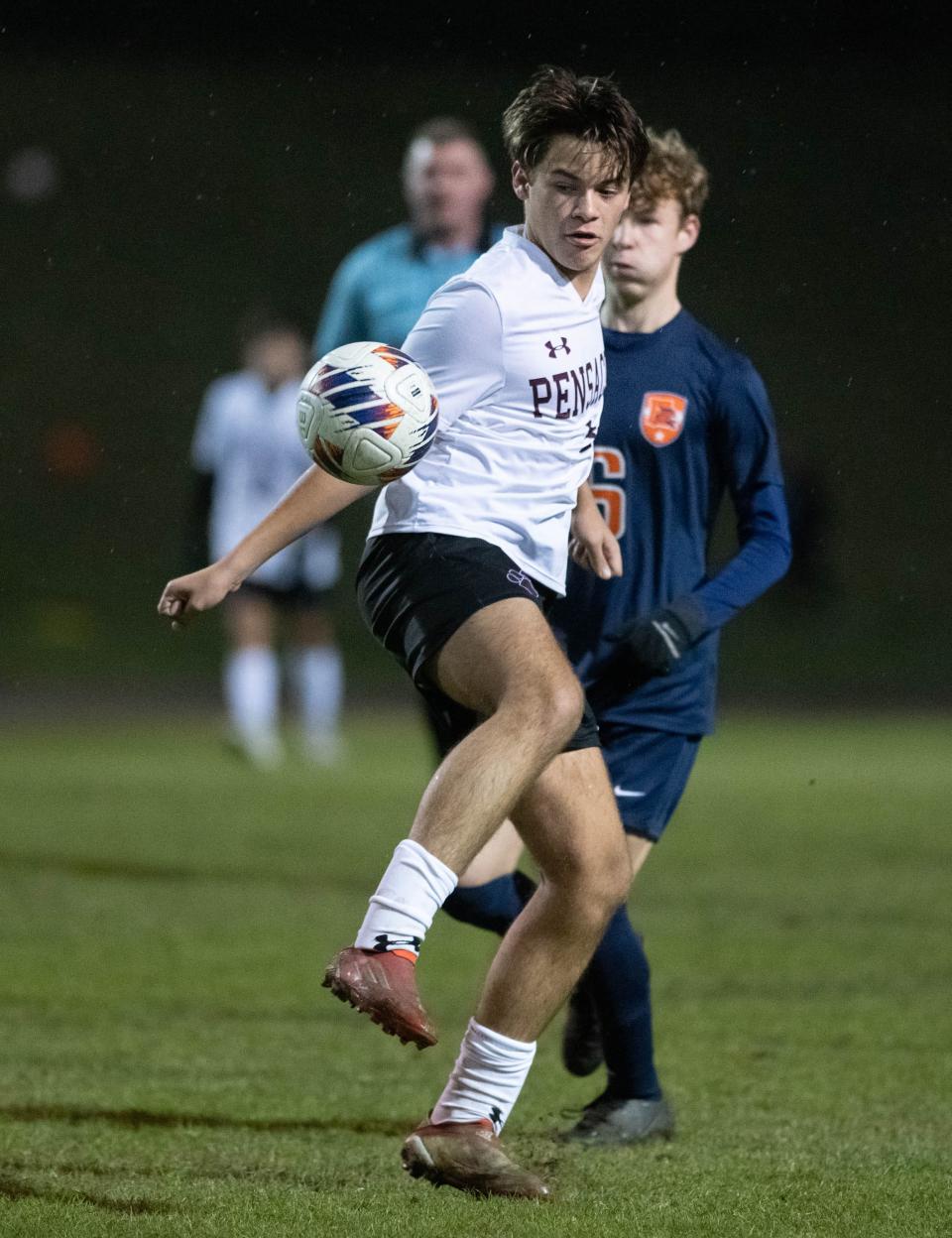 Cooper Nolen (9) takes control of the ball during the Pensacola vs Escambia boys soccer game at Escambia High School in Pensacola on Monday, Dec. 19, 2022.