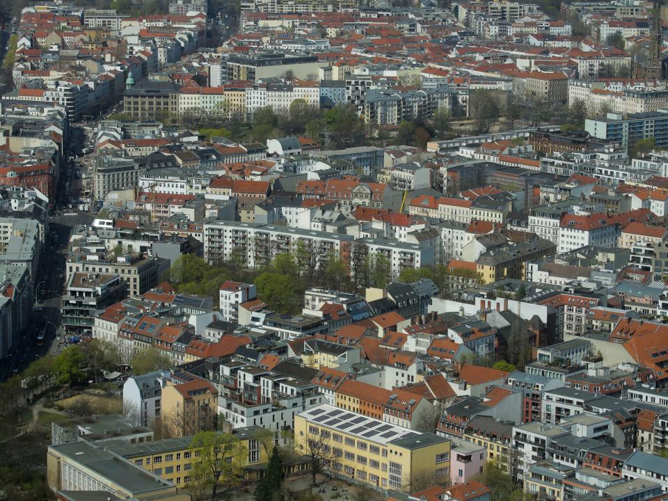 FILE - In this Thursday, April 4, 2019, file photo, Apartment buildings in the district Mitte photographed from the television tower in Berlin, Germany.The city of Berlin is freezing the rent of 1.5 million apartments for the next five years starting this Sunday in a controversial move to control the exploding costs that have forced many to move outside the city. Berlin is the first city in Germany to influence the rental prices so directly and the law has been both celebrated as a step toward more fairness by its supporters and ripped apart as a socialist method by critics. (AP Photo/Markus Schreiber, file)