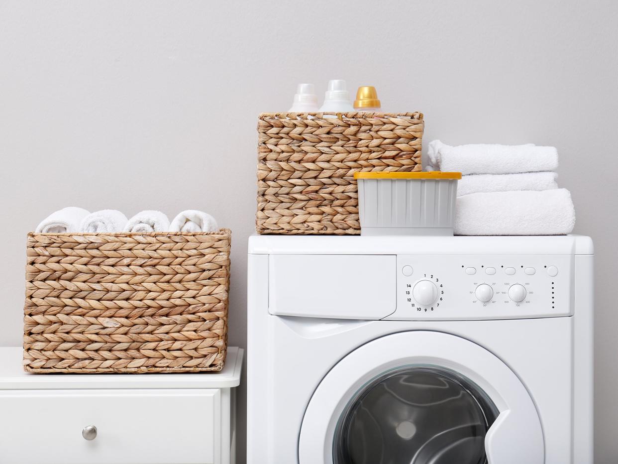 laundry room with baskets and folded towels