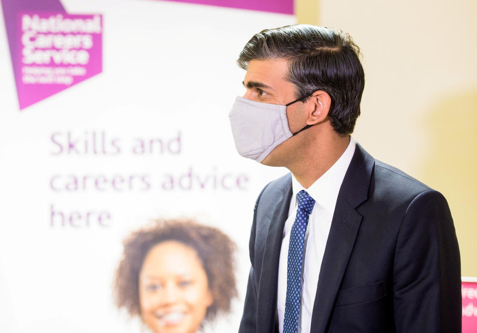 Britain's Chancellor of the Exchequer Rishi Sunak wearing a face mask visits the Jobcentre Plus to see the new support being provided in job centres by the doubling of work coaches, following the coronavirus disease (COVID-19) outbreak in Barking, London, Britain July 16, 2020. Anthony Upton/Pool via REUTERS