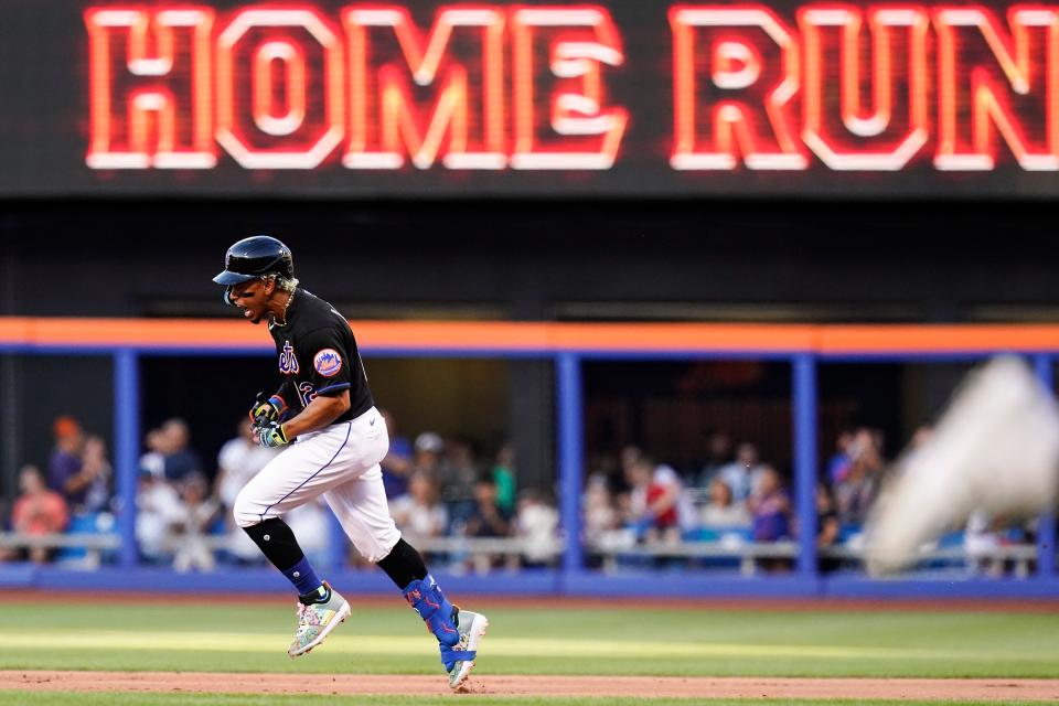 New York Mets' Francisco Lindor celebrates as he runs the bases after hitting a three-run home run during the first inning of a baseball game against the Miami Marlins, Friday, June 17, 2022, in New York.