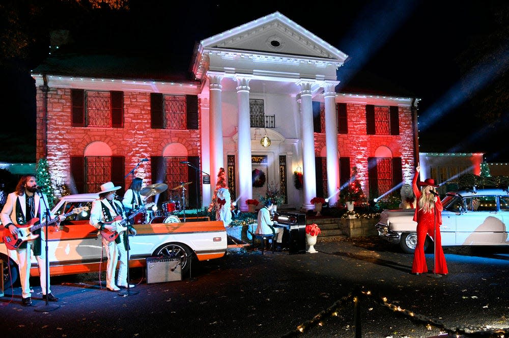 Lainey Wilson performs in front of the Graceland mansion in Memphis during NBC's "Christmas at Graceland" TV special on Wednesday, Nov. 29, 2023.