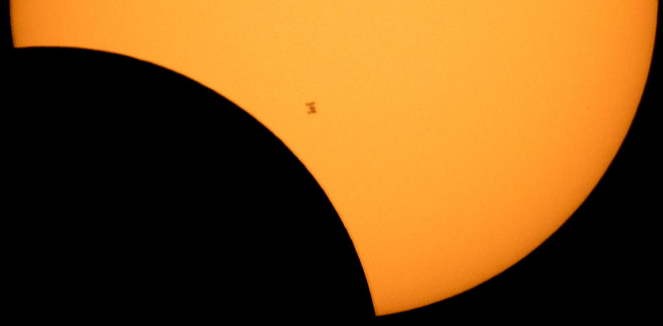 <p>The International Space Station, in silhouette, as it transits the sun during a partial solar eclipse seen from Ross Lake, Northern Cascades National Park, Washington, Aug. 21, 2017. (Photo: Bill Ingalls/NASA/Reuters) </p>