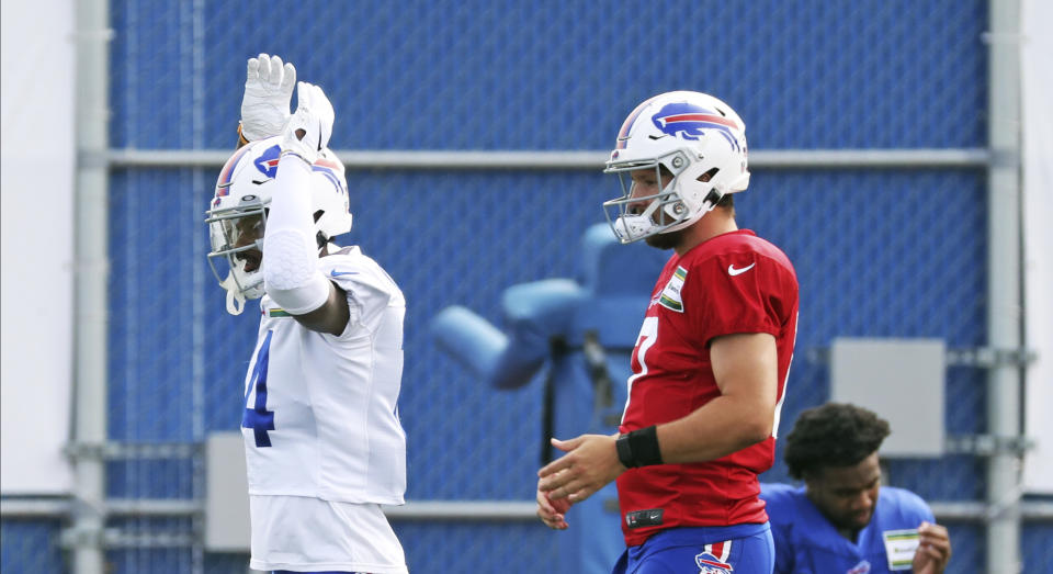 Buffalo Bills wide receiver Stefon Diggs (14) cheers on his teammates as they stretch during NFL football practice in Orchard Park, N.Y., Thursday, Sept. 3, 2020. (James P. McCoy/The Buffalo News via AP, Pool)