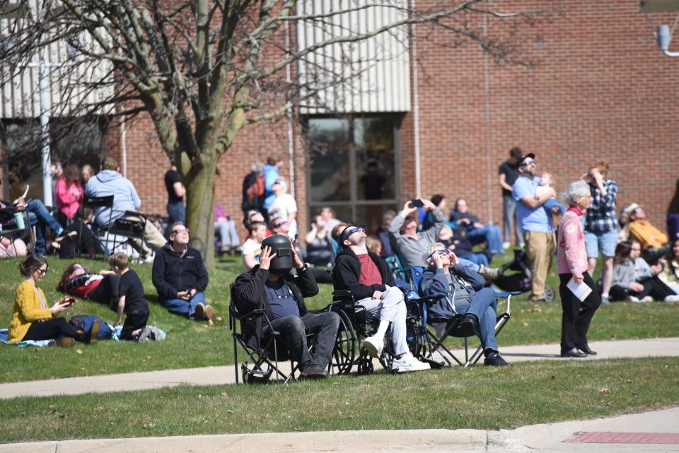 Hundreds of people sat on the lawn outside SC4's College Center on April 8, 2024 to watch the partial solar eclipse.