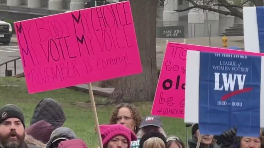 Abortion rights groups with signs in Denver