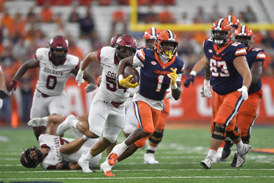 Syracuse running back LeQuint Allen Jr. (1) runs with the ball during the first half of an NCAA college football game against Colgate in Syracuse, N.Y., Saturday, Sept. 2, 2023. (AP Photo/Adrian Kraus)
