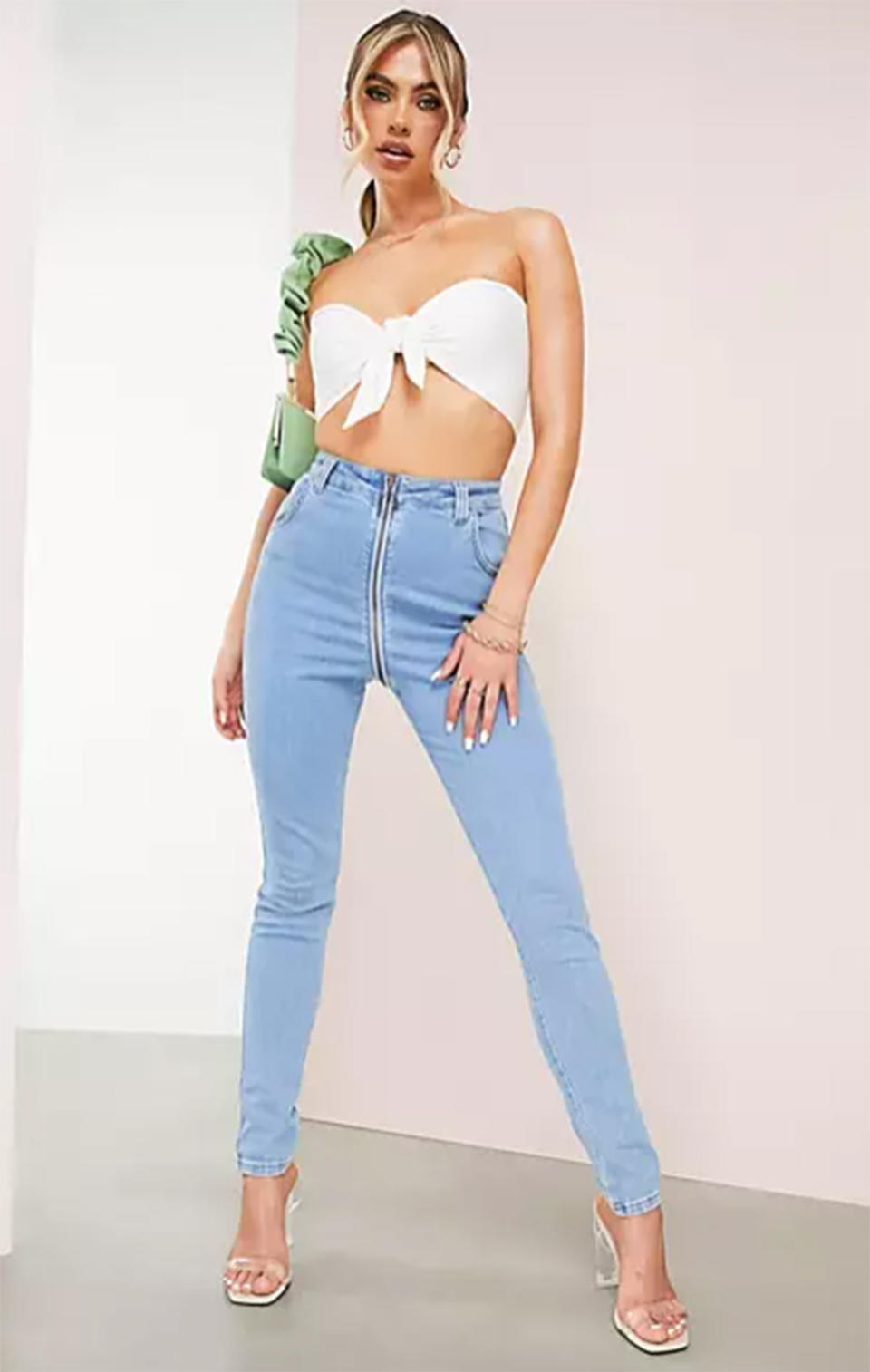 A model wearing ASOS LUXE Hourglass skinny jean with zip-through detail in blue