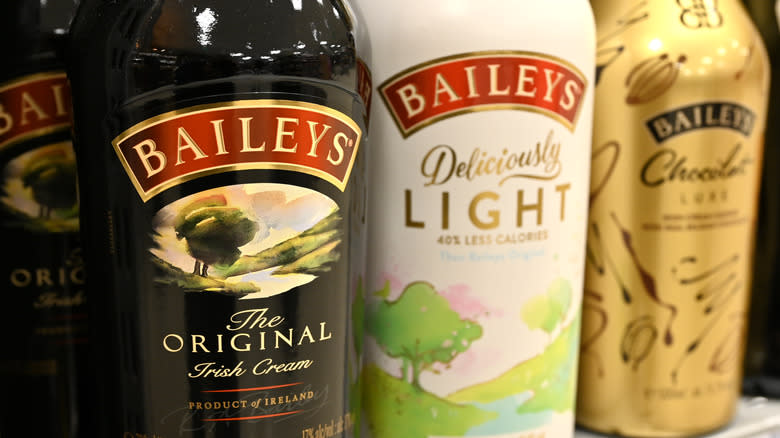 Bottles of Baileys on shelves.