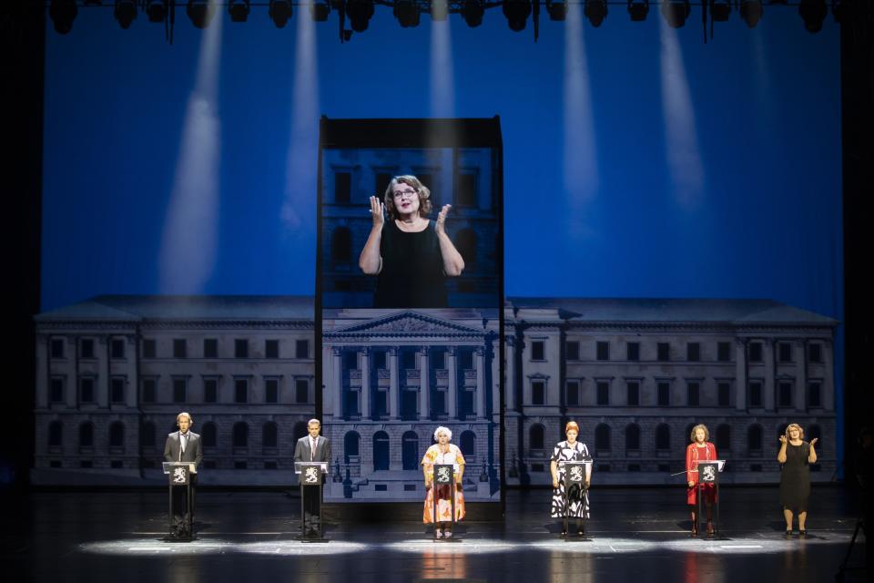 Singers at the Finnish National Opera rehearse "Covid fan tutti," a satirical take on a famed opera by Wolfgang Amadeus Mozart but with an adapted contemporary story line that reflects the Nordic country's pandemic experiences, in Helsinki, on Thursday Aug. 20, 2020. The show follows the lives of ordinary Finish people, the news conferences by the government and pandemic experts with satirical undertones. (Stefan Bremer/Finnish National Opera via AP)