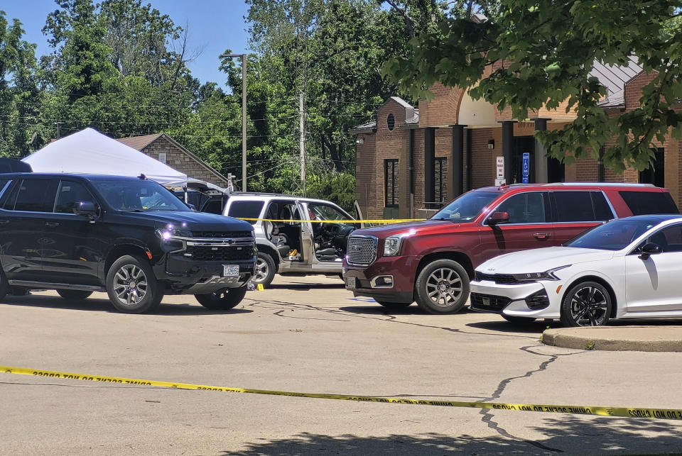 Law enforcement officers investigate a vehicle that was driven to Festus City Hall and Police Station, Tuesday morning, May 28, 2024, in Festus, Mo., by a woman who allegedly told officers she killed two of her children. (Tony Krausz/Leader Publications via AP)