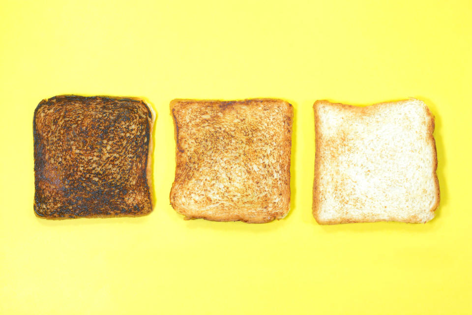 Badly burnt, rightly toasted and plain bread slice on yellow background.