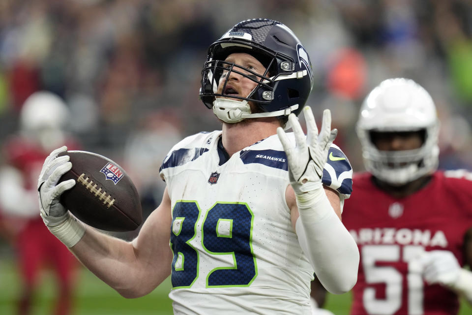 Seattle Seahawks tight end Will Dissly (89) scores a touchdown against the Arizona Cardinals in the first half of an NFL football game Sunday, Jan. 7, 2024, in Glendale, Ariz. (AP Photo/Ross D. Franklin)
