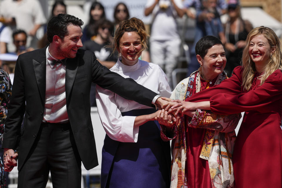 Josh O'Connor, from left, director Alice Rohrwacher, Isabella Rossellini and Alba Rohrwacher pose for photographers upon arrival at the premiere of the film 'La Chimera' at the 76th international film festival, Cannes, southern France, Friday, May 26, 2023. (Photo by Scott Garfitt/Invision/AP)