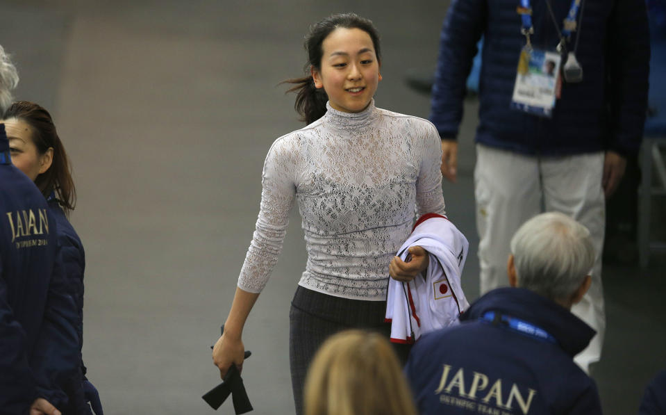 Mao Asada of Japan walks after a practice session at the figure stating practice rink at the 2014 Winter Olympics, Monday, Feb. 17, 2014, in Sochi, Russia. (AP Photo/Vadim Ghirda)