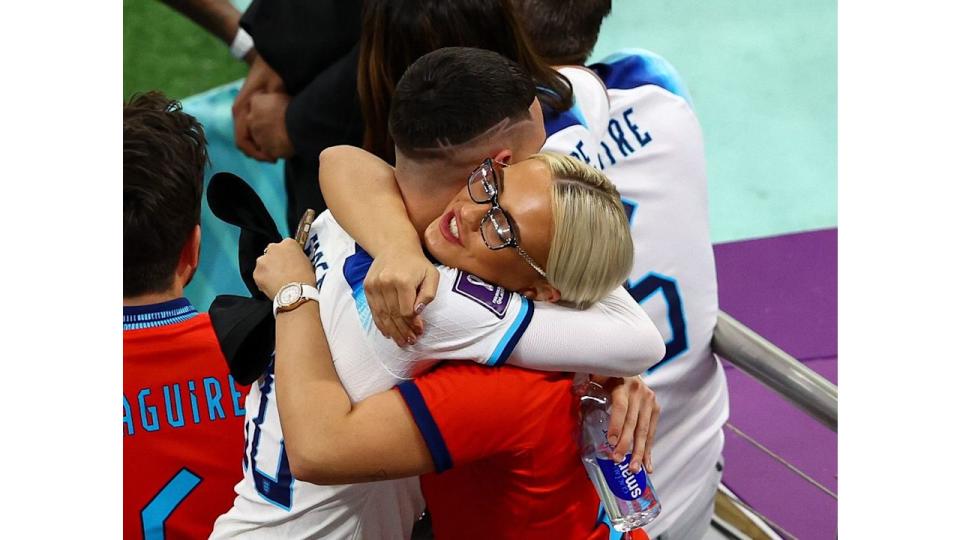 Phil Foden hugging his partner Rebecca Cooke