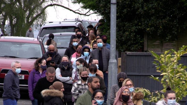 People queue for vaccination